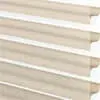 Soft beige fabric blinds with horizontal slats, stylish and functional window treatment for modern homes.