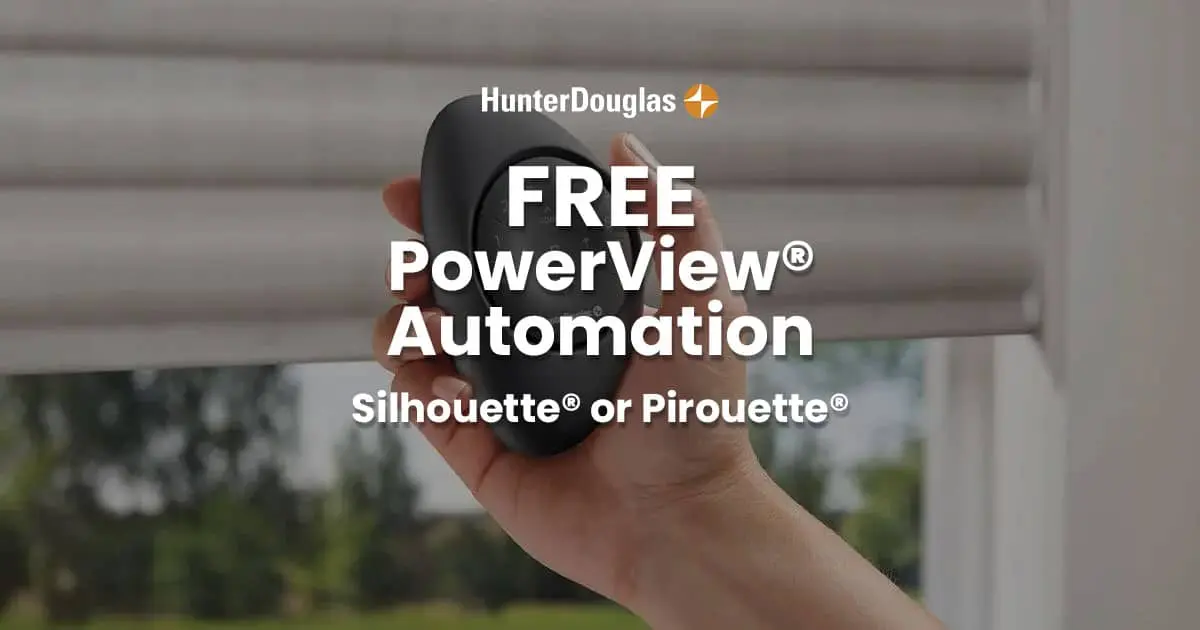 Close-up of a hand holding a black sphere with HunterDouglas PowerView Automation logo, outdoor background with blinds and trees.