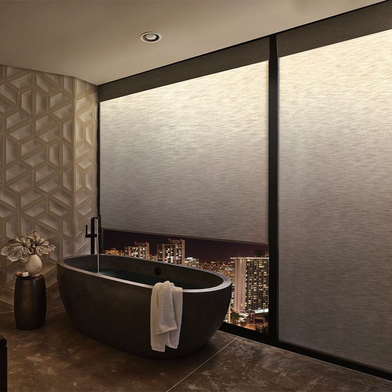 Luxury roller blinds for modern bathrooms with city views, blackout window treatments for privacy and style, advanced blinds and drapery custom window coverings, sleek and elegant design for upscale interiors.