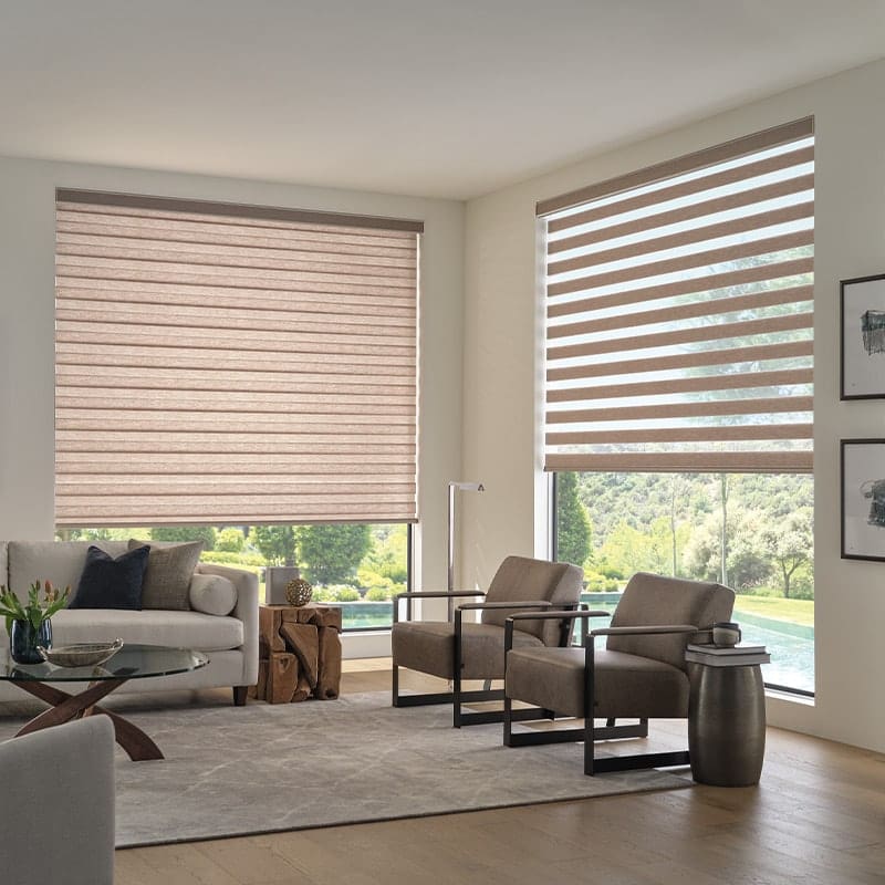 Luxurious beige zebra blinds in a modern living room with floor-to-ceiling windows, offering style and light control. Perfect for home decor, privacy, and sun protection.