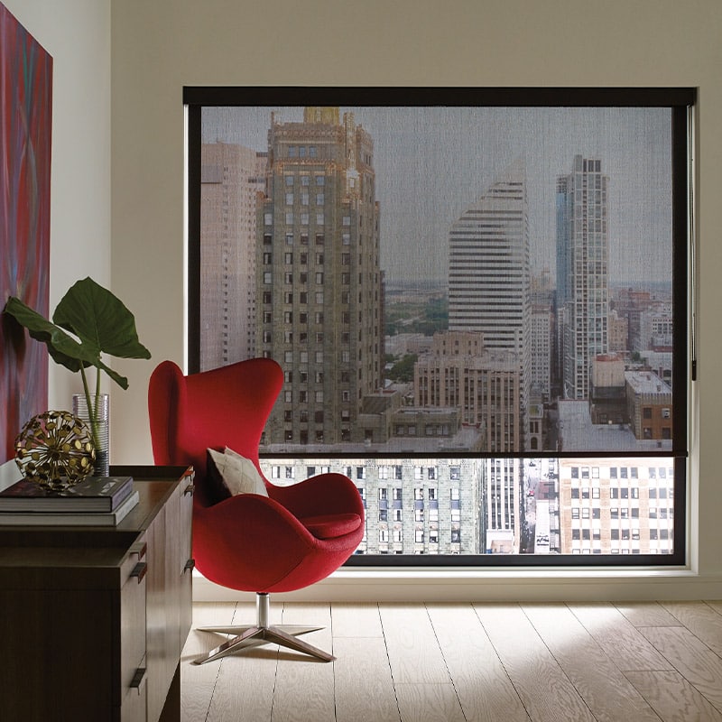 Custom roller blinds for modern city apartments, providing stylish window treatment options by Blinds West. Perfect for controlling light and enhancing home decor.