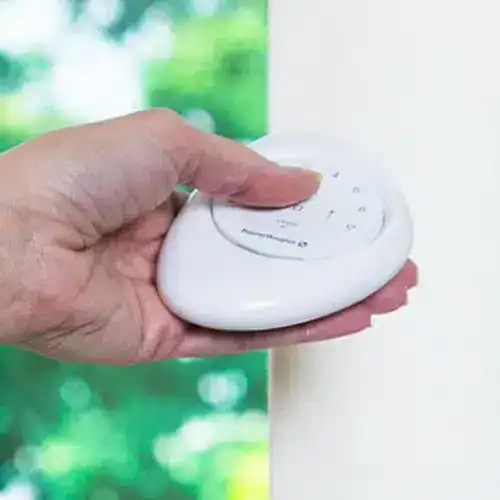 White wireless remote control for window blinds and shades at Blinds West.
