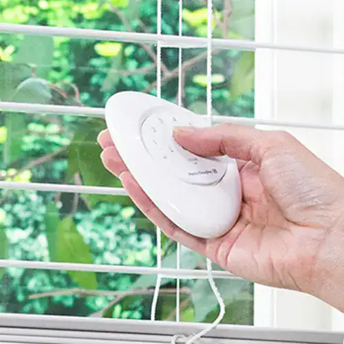 Remote control for motorized window blinds by Blinds West, offering convenient and modern window treatment solutions.