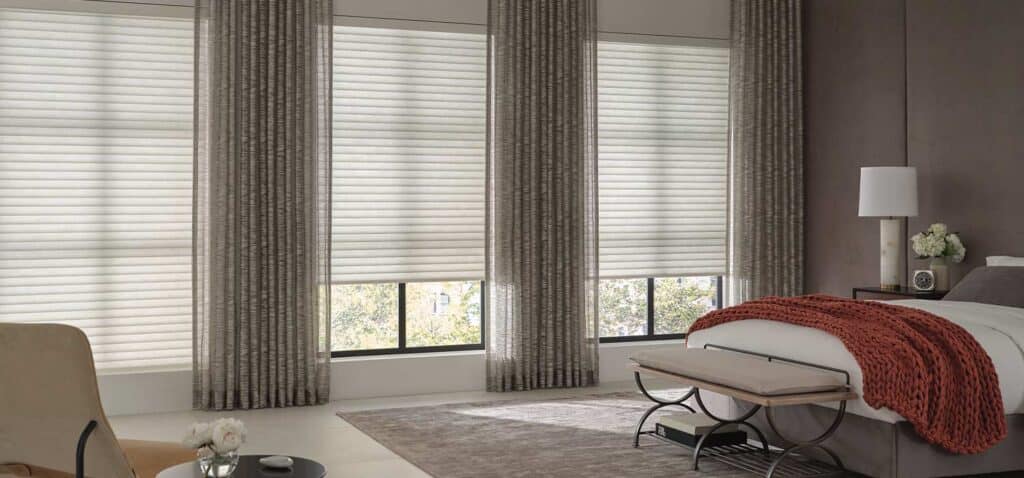 Luxurious window blinds and drapes from Blinds West providing privacy and style for modern bedrooms, with customizable options and expert installation services.