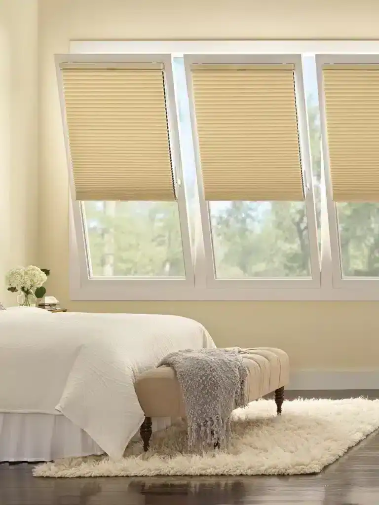 Silhouette beige window blinds in a cozy bedroom setting for privacy and light control.