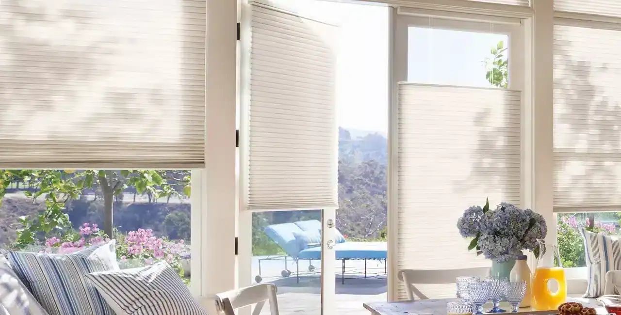 Light-filtering window blinds and shades in a bright, sunlit living space for enhanced privacy and energy efficiency. Perfect for home decor and interior design.