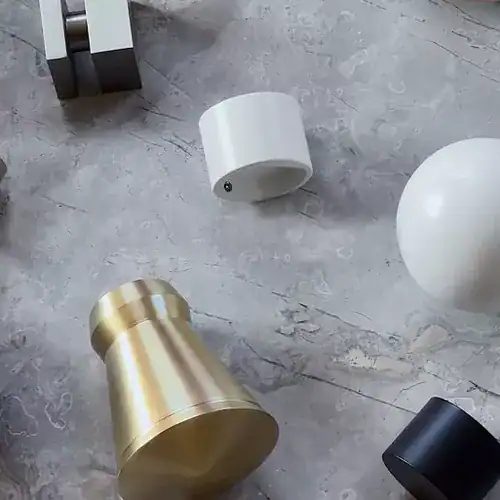 Sophisticated modern curtain rod finials in gold, black, white, and chrome finishes, ideal for contemporary window treatments and drapery hardware.