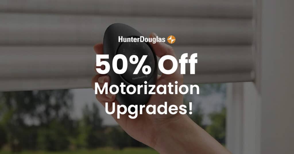 Hand holding a smartphone displaying a Hunter Douglas promotion for 50% off motorization upgrades, highlighting smart home automation and window treatment enhancements.