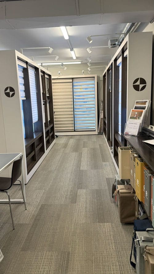 Modern Calgary showroom interior featuring display shelves, window blinds, and organized product displays for a professional retail environment.